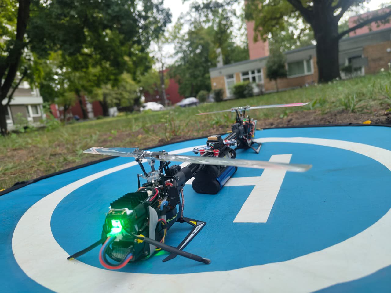 D.A.R.T. prototype on an outdoor landing pad, side view showing both rotors